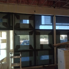 Roller shades lowered, except for the door